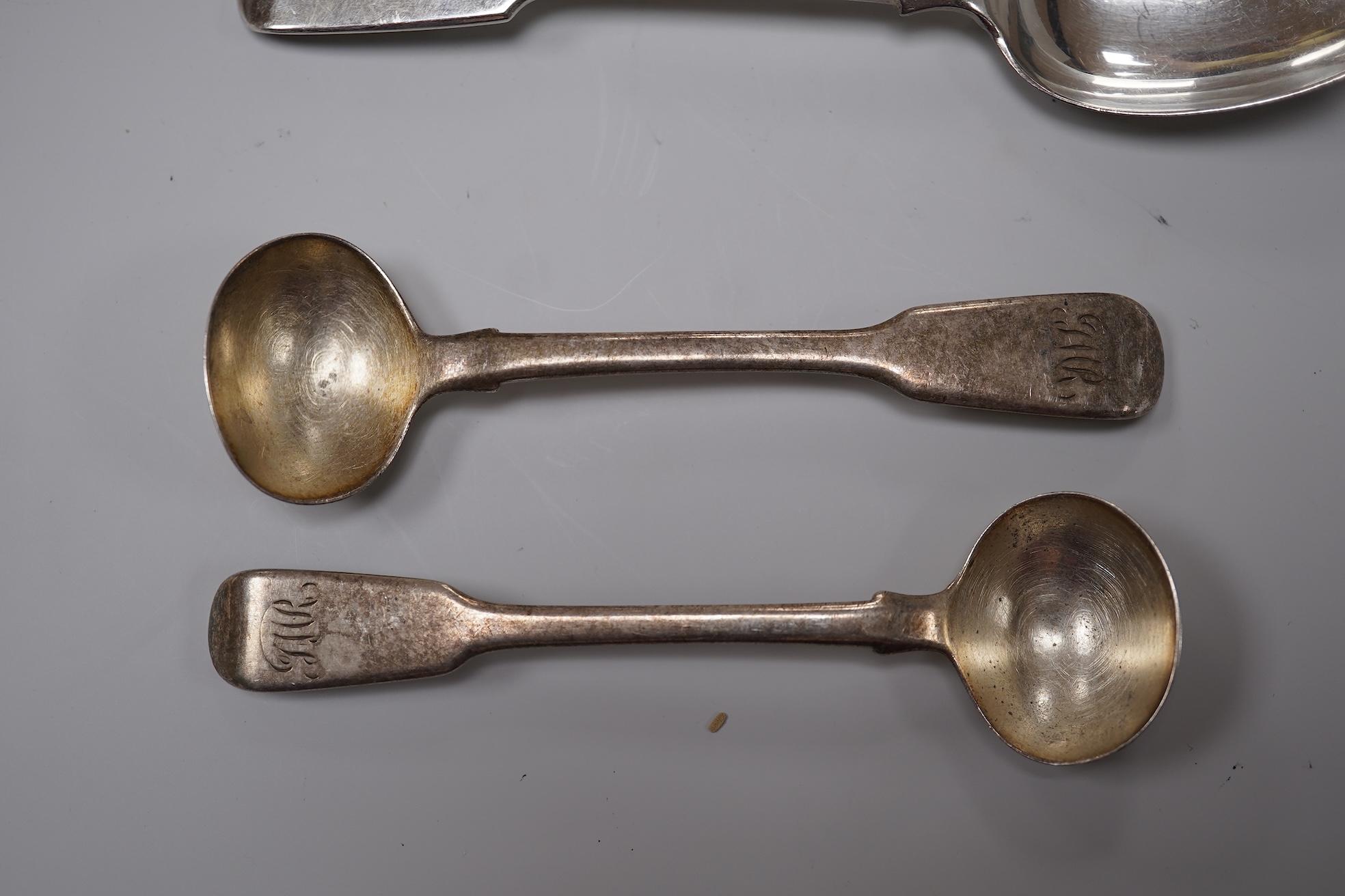 A George V silver christening mug, George Howson, Sheffield, 1934, height 77mm, together with one other silver mug, a small silver two handled cup, a silver salt and a small quantity of assorted silver flatware, 22.7oz.